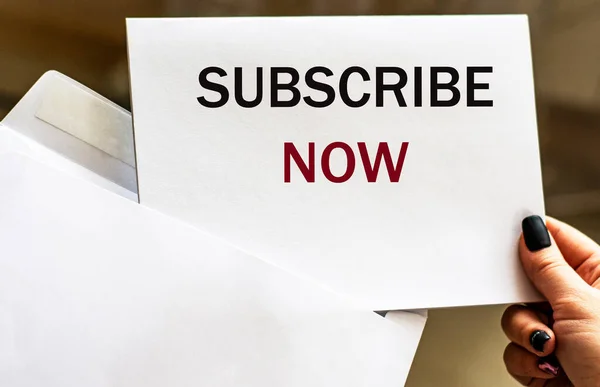 SUBSCRIBE NOW - words written in letter from envelope.