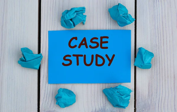 CASE STUDY - word on blue paper on a light background with crumpled pieces of paper. Business concept