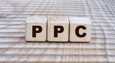 Küpler üzerinde güzel bir arkaplan üzerinde PPC (tıklama başına ödeme) sözcüğü kavramı. İş konsepti