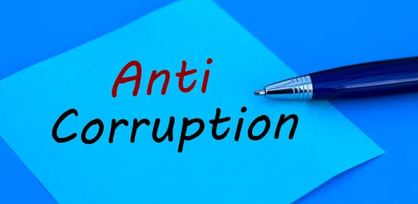 Palabras Corrupción Escritas Con Bolígrafo Sobre Papel Azul Sobre Fondo — Foto de Stock