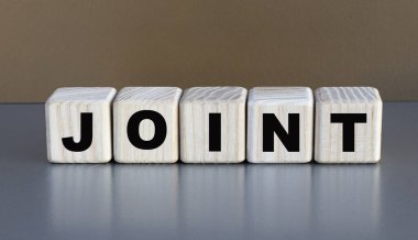 JOINT - güzel bir kahve arka planında küplerle ilgili bir söz. İş konsepti