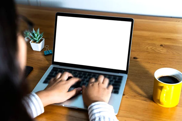 Computer mockup white background on desk. Laptop with blank screen.