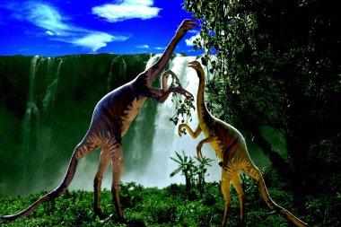Ornithomimus cinsinden iki dinozor arka ayakları üzerinde duruyor ve büyük bir şelalenin önündeki ağaçtan yapraklar yiyorlar.