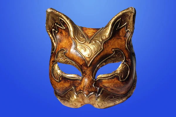 an ancient golden cat mask used during the Venice carnival