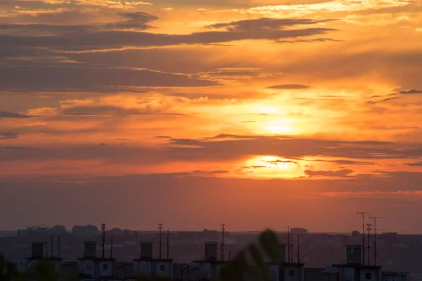 The dynamics of the sunset in the big city of Kharkov in Ukraine and the horizon opening in its splendor cutting through the stunning in its contrast clouds a magnificent evening landscape painted by the Creator of everything visible and invisible!