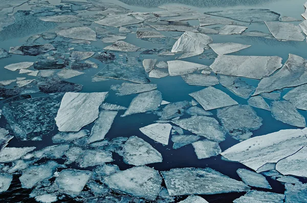 Natural ice blocks in water. Sea ice drifting