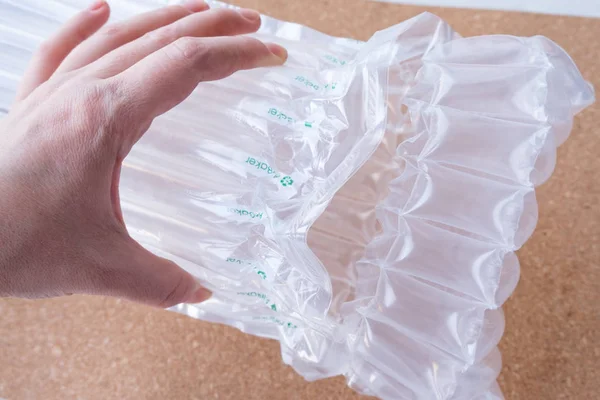 translucent air packaging hands hold, protection of goods, plastic packaging