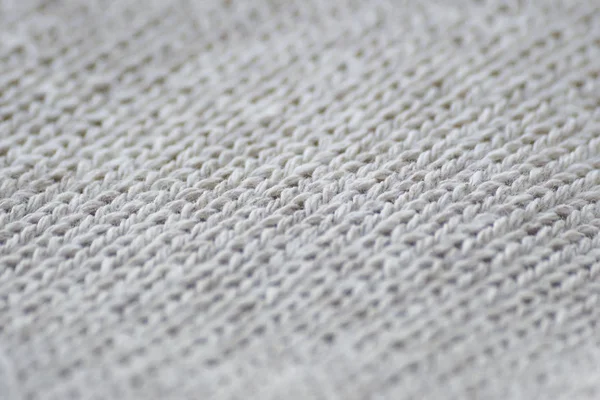 Gri kumaş giyim doku kapatın. Arka plan bulanıklık.