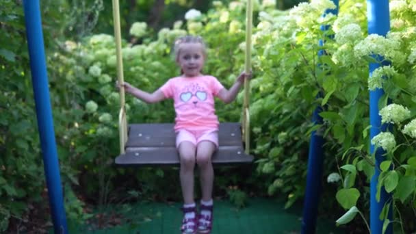 Little Girl Swinging Swing Trying Swing Harder — Stock Video