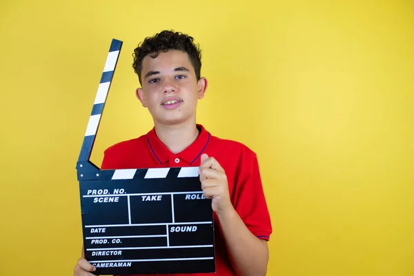 Beautiful Teenager Boy Isolated Yellow Background Holding Clapperboard Very Happy — Stock Photo, Image