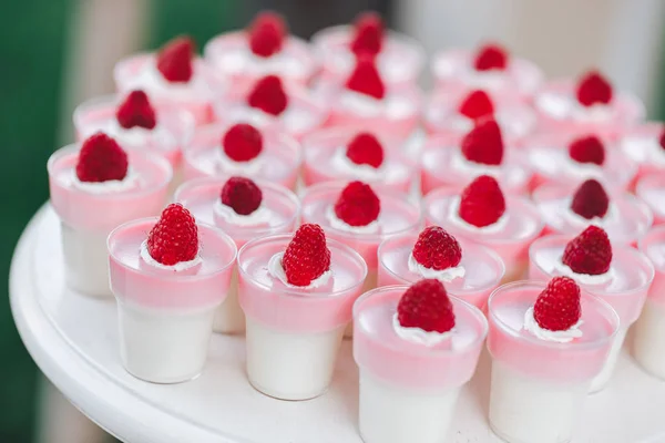 Raspberry mousse in jars. Dessert for holiday