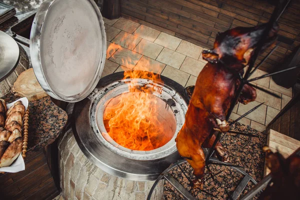 Grilled pig and lamb on fire and coal, hot tandoor grill. Hot Meat dishes
