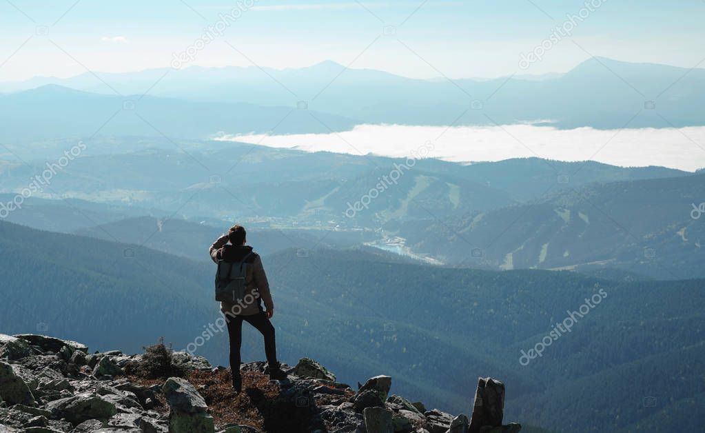 Happy hiker winning reaching life goal, success, freedom and hap