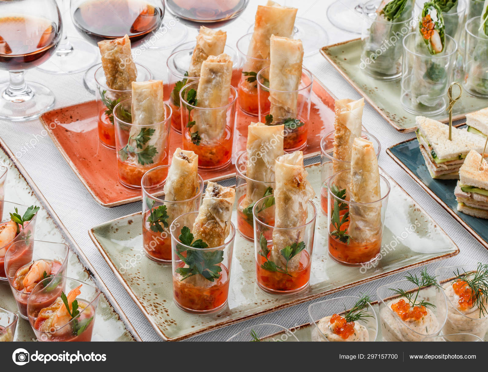 Delicious appetizers in glass cups on banquet table. Catering food, canape  and snacks Stock Photo by ©Valentinjukov 297157700