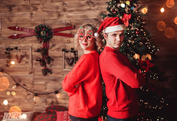 Family couple on holiday in living room decorated by Christmas tree and present gift boxes. Portrait loving family close up, New Year and Xmas holiday — Stockfoto