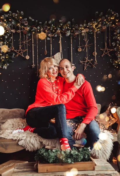Family couple kiss and hugging on holiday. Living room decorated by Christmas tree and present gift boxes. Portrait loving family close up, New Year and Xmas holiday — Stockfoto