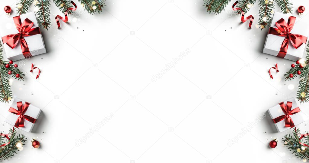 Creative frame made of Christmas fir branches, gift boxes, red decoration, sparkles and confetti on white background. Xmas and New Year holiday, bokeh, light. Flat lay, top view