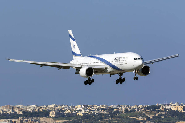 Luqa, Malta - November 13, 2018: El Al Israel Airlines Boeing 777-258/ER (REG: 4X-ECB) landing runway 13, arriving for painting works at ACM Malta.