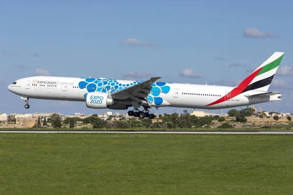 stock image Luqa, Malta - November 29, 2018: Emirates Boeing 777-31H/ER (Reg: A6-EGB) in special EXPO 2020 Dubai colour scheme landing runway 31.