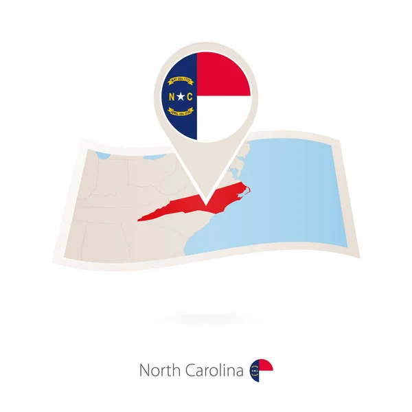 ノースカロライナ州の旗ピンとノースカロライナ州の紙の地図を畳んだ ベクトル図 — ストックベクタ