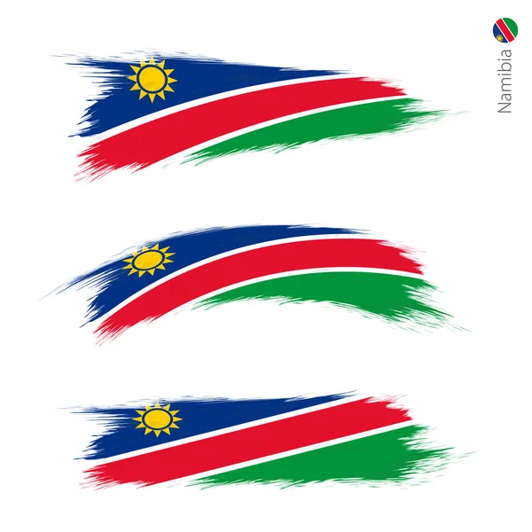 グランジ テクスチャ ナミビアの旗 つのバージョン ブラシ ストローク スタイルを描かれた国家国旗のセットします ベクトル フラグ — ストックベクタ