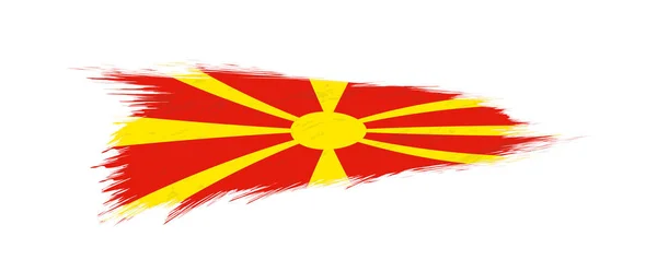 Flaga Macedonii w pociągnięcia pędzlem grunge. — Wektor stockowy