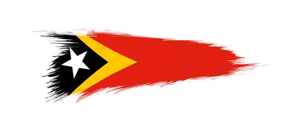 Bandera de Timor Oriental en pincelada grunge . — Vector de stock