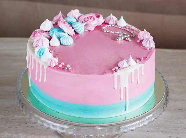 Pink cake for the baptism of a girl on a light background with meringues and a cross — Stock Photo, Image