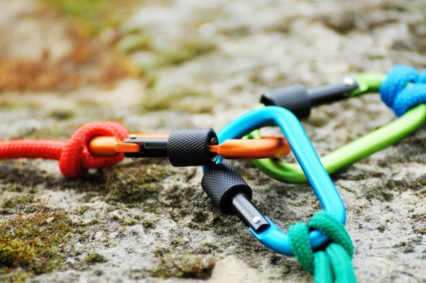 Metal carabine for mountaineering. Photo of colored carabines.  Climbing concept
