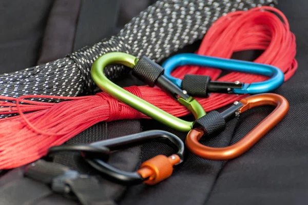 Metal carabine for mountaineering. Photo of colored carabines. Climbing concept