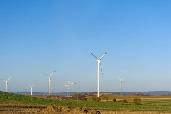 Wind turbines generating electricity. Electrical windmills.