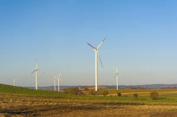 Wind turbines generating electricity. Electrical windmills.