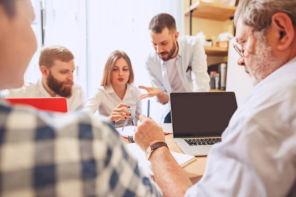 Team job. Photo young businessmans working with new project in office — Stock Photo, Image