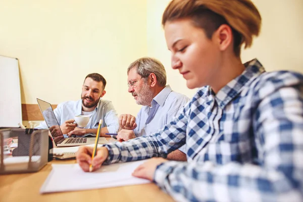 Team job. Photo young businessmans working with new project in office — Stock Photo, Image