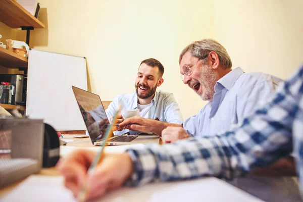 Team job. Photo young businessmans working with new project in office — Stock Photo, Image