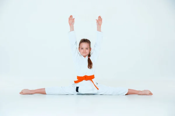 The girl posing at Aikido training in martial arts school. Healthy lifestyle and sports concept — Stock Photo, Image