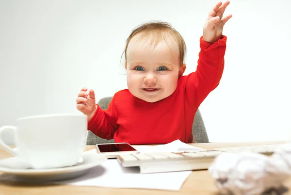 Happy child baby girl toddler sitting with keyboard of computer isolated on a white background — Stock Photo, Image