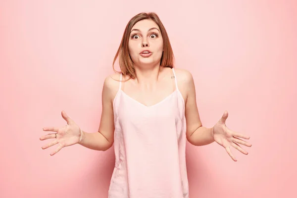 Beautiful woman looking suprised isolated on pink — Stock Photo, Image