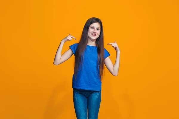 The happy teen girl standing and smiling against pink background. — Stock Photo, Image