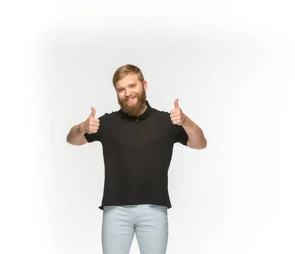 Closeup of young mans body in empty black t-shirt isolated on white background. Mock up for disign concept — Stock Photo, Image