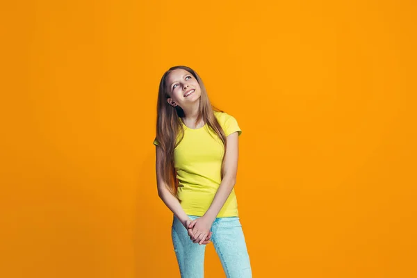 The happy teen girl standing and smiling against pink background. — Stock Photo, Image