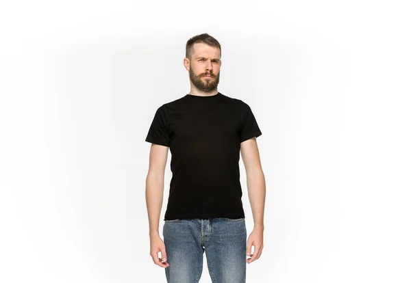Closeup of young mans body in empty black t-shirt isolated on white background. Mock up for disign concept — Stock Photo, Image