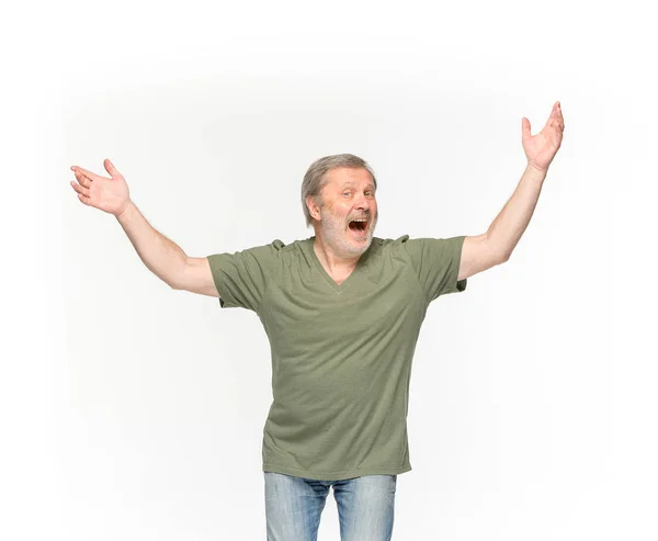 Closeup of senior mans body in empty green t-shirt isolated on white background. Mock up for disign concept — Stock Photo, Image