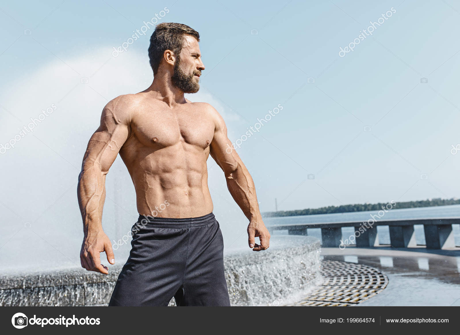 Fit fitness man posing at city Stock Photo by ©vova130555@gmail
