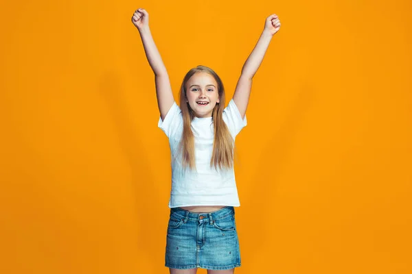 Happy success teen girl celebrating being a winner. Dynamic energetic image of female model — Stock Photo, Image