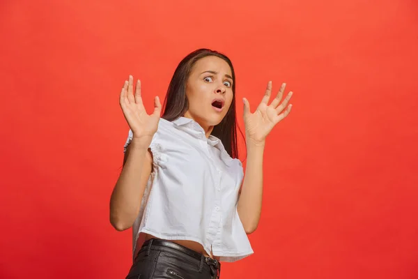 Portrait of the scared woman on red — Stock Photo, Image