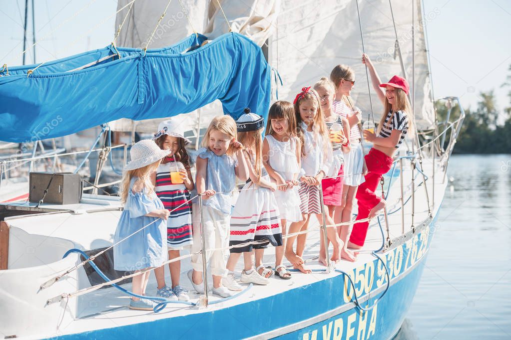 The children on board of sea yacht