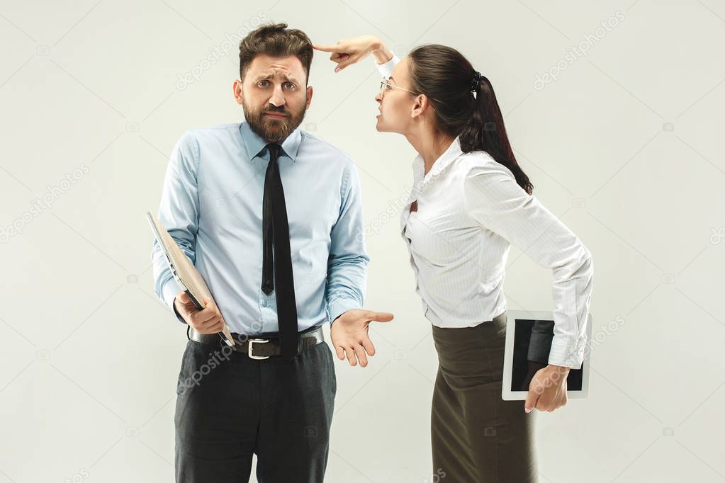 Angry boss. Woman and secretary standing at office or studio