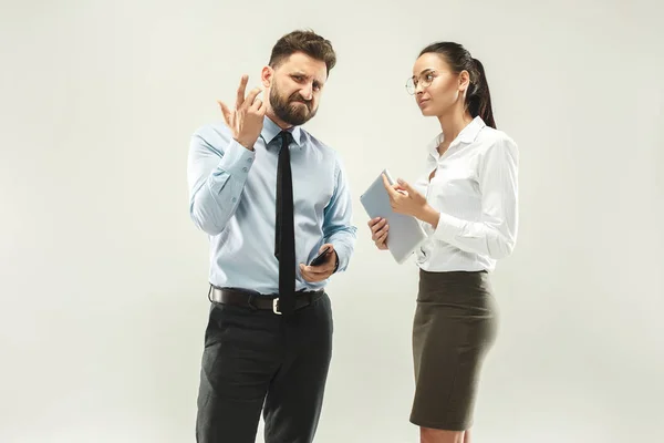 Angry boss. Man and his secretary standing at office or studio — Stock Photo, Image