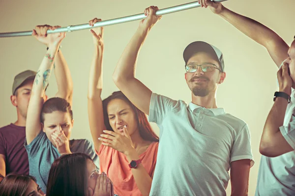 Sweaty armpits. Sweaty man. Bus. Public transport. The unhappy people near man